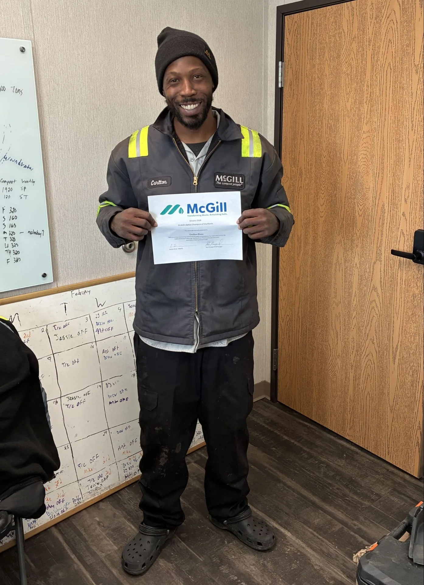McGill Safety Champion of the Month holding certificate
