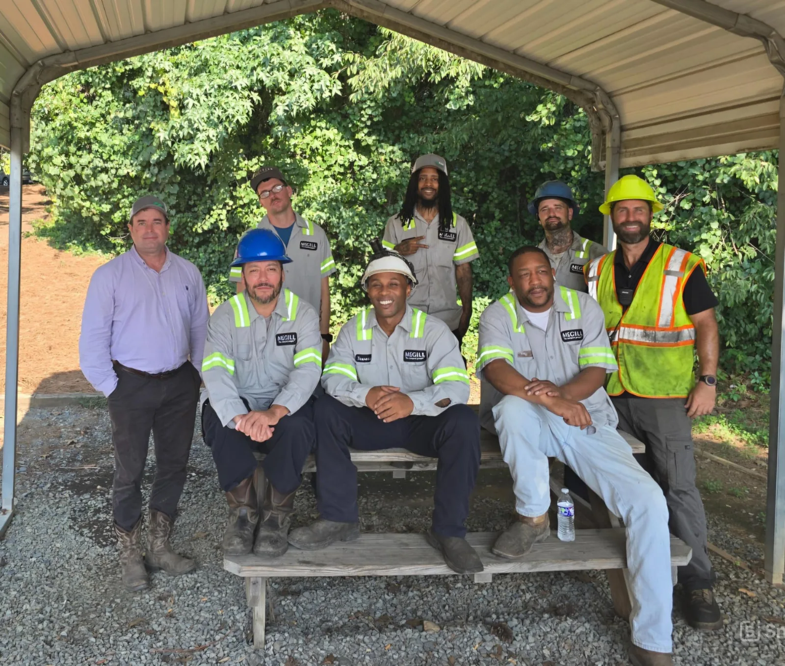 McGill plant team gathered at a covered picnic shelter for a group photo