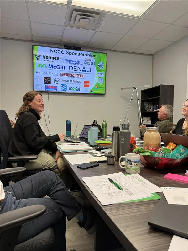 McGill team meeting reviewing NCCC sponsorships on screen